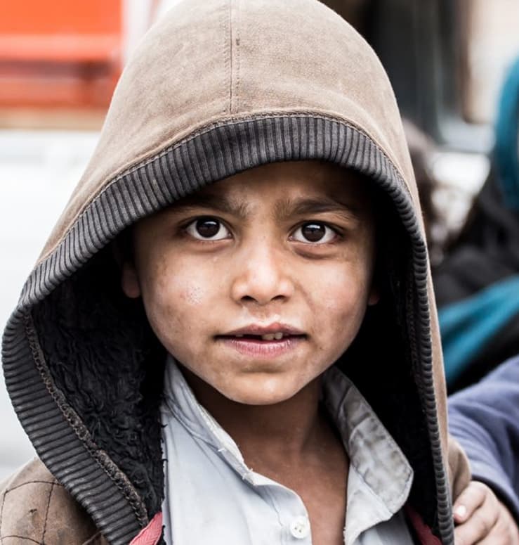 Child in hoodie representing our mission